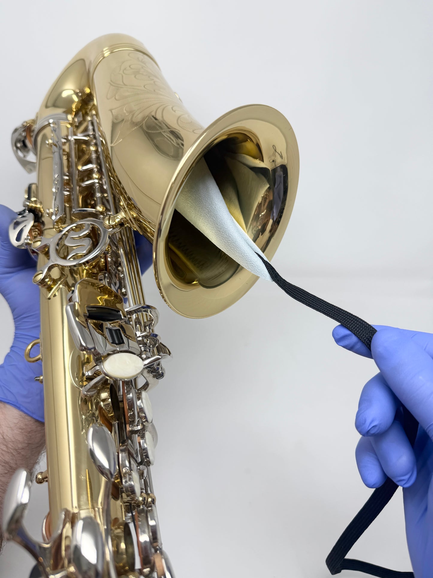 Weighted-end large saxophone swab after use