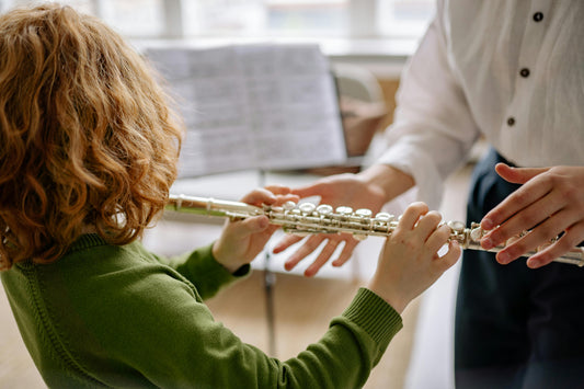 Boy Playing flute from behind