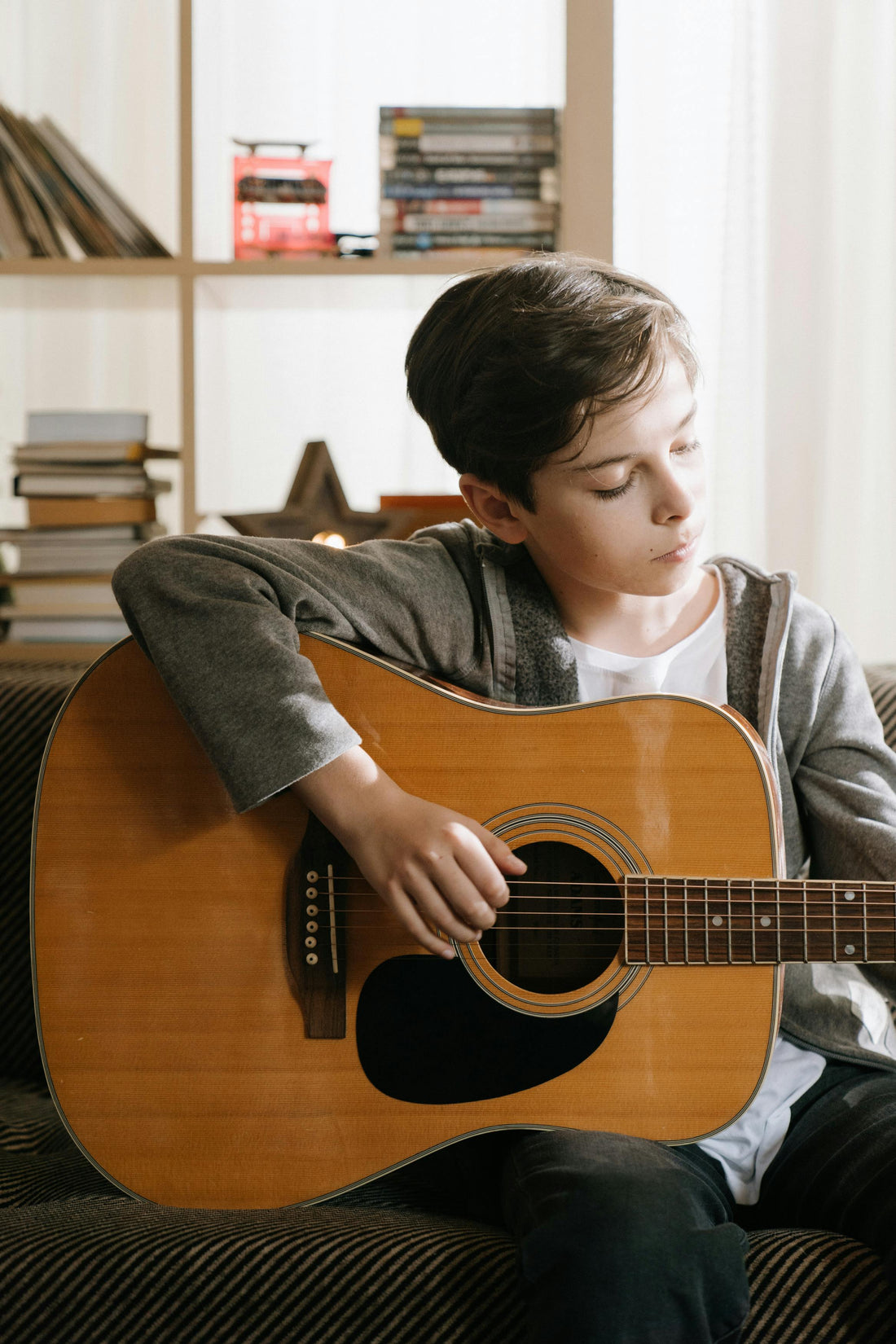 Boy playing classical guitar