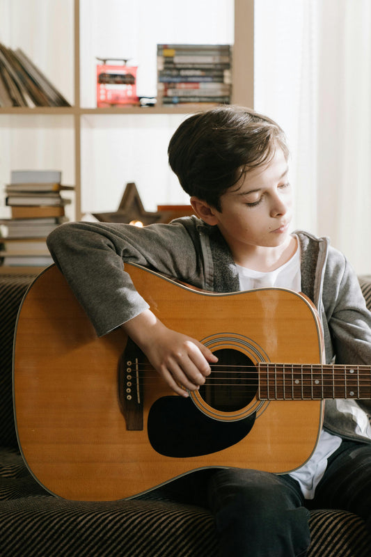 Boy playing classical guitar