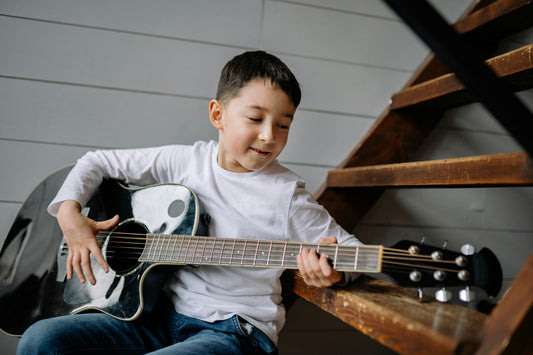 Boy Playing Acoustic Guitar