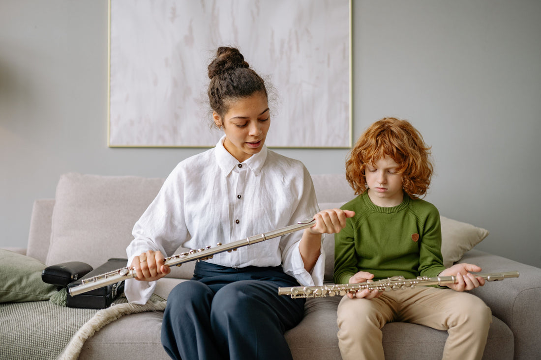 Flute Teacher with Student adjusting flute