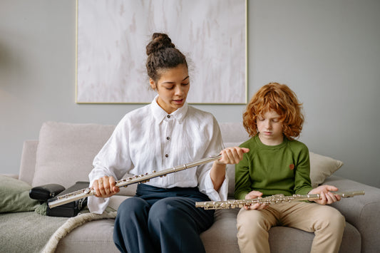 Flute Teacher with Student adjusting flute