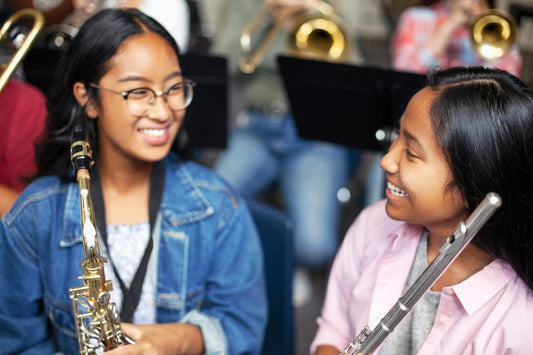 Girl with saxophone and girl with flute