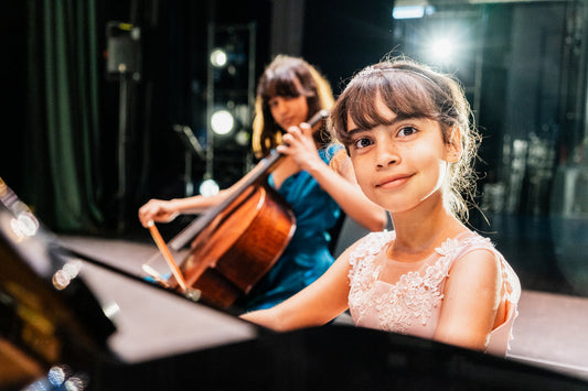 girl at piano with cellist 