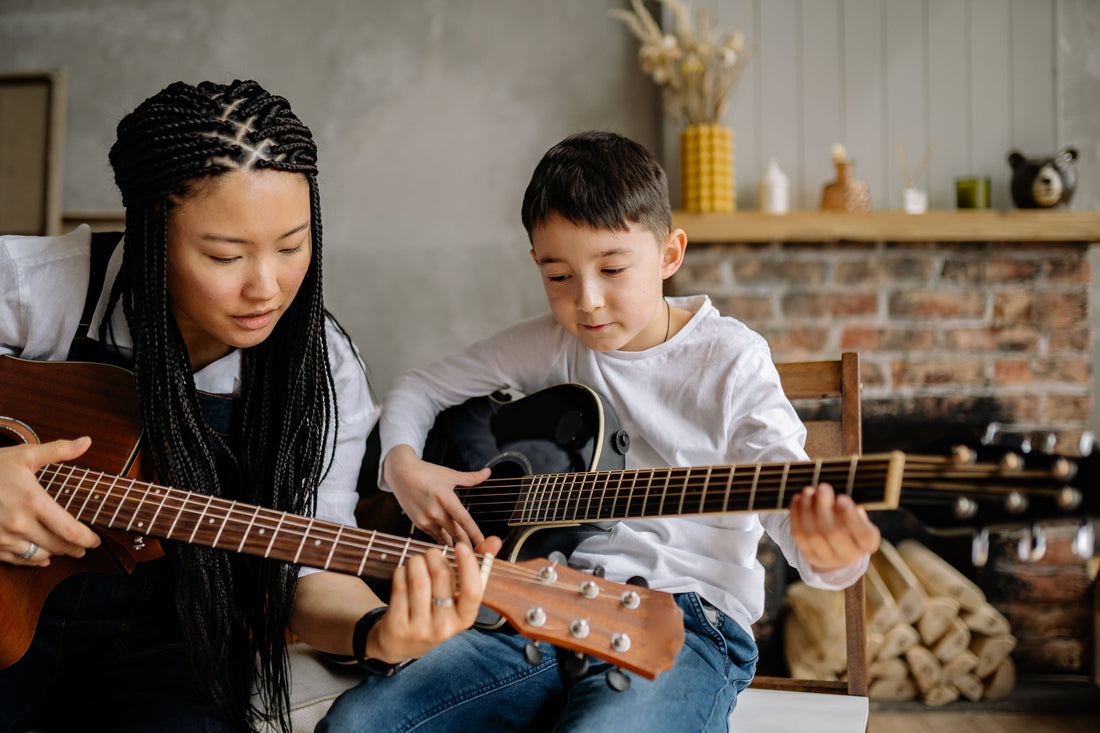 Guitar Teacher Instructing guitar student