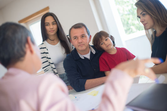 Parents with teachers and child