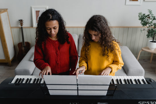 Parent and child at piano