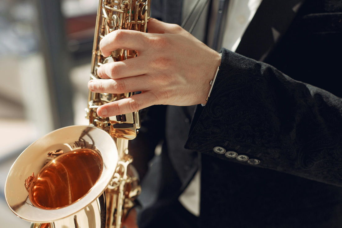 close up person playing saxophone