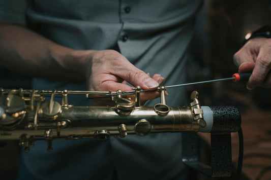 Sax Technician fixing a sax wire