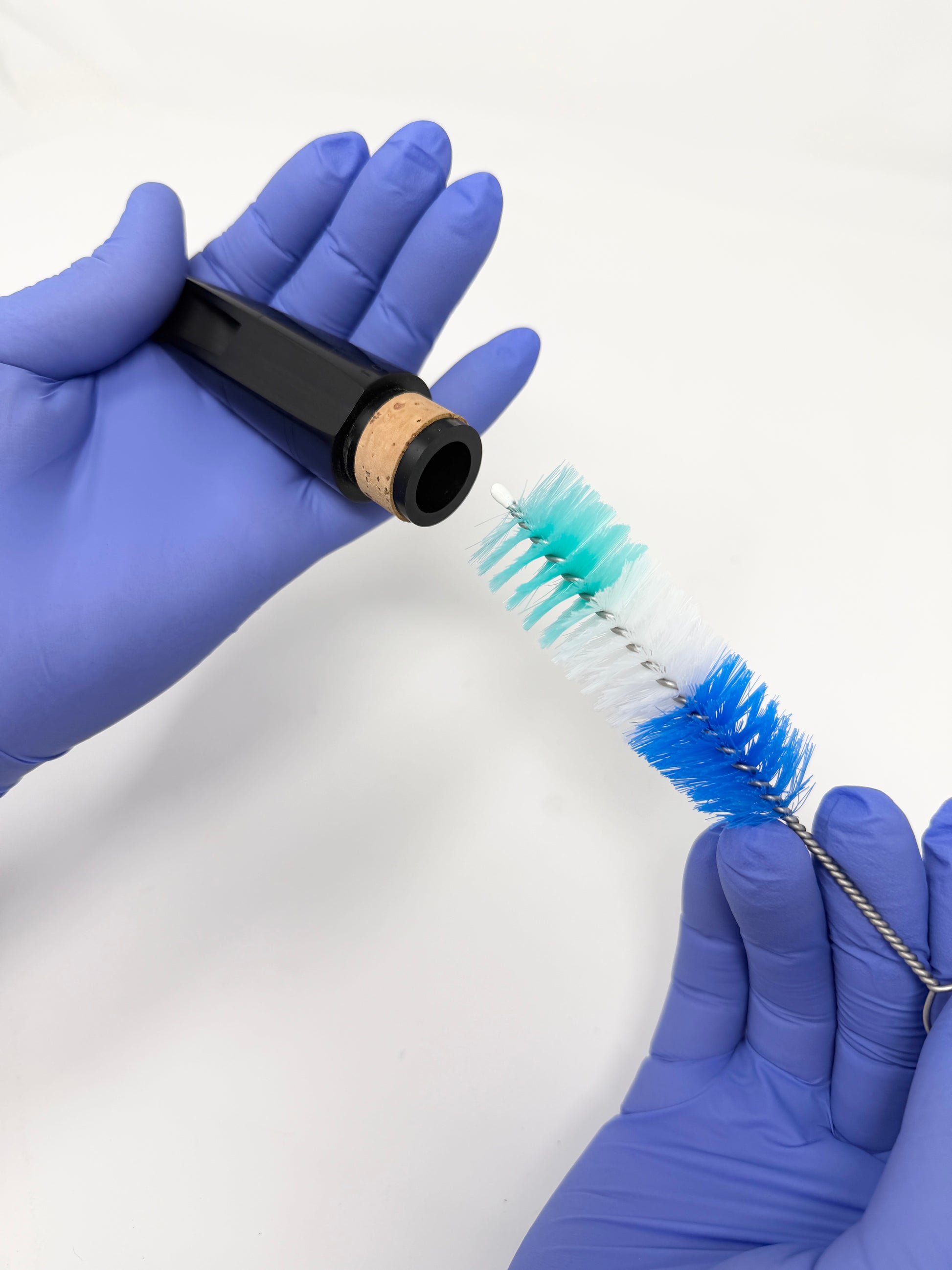 Brush for cleaning a clarinet mouthpiece