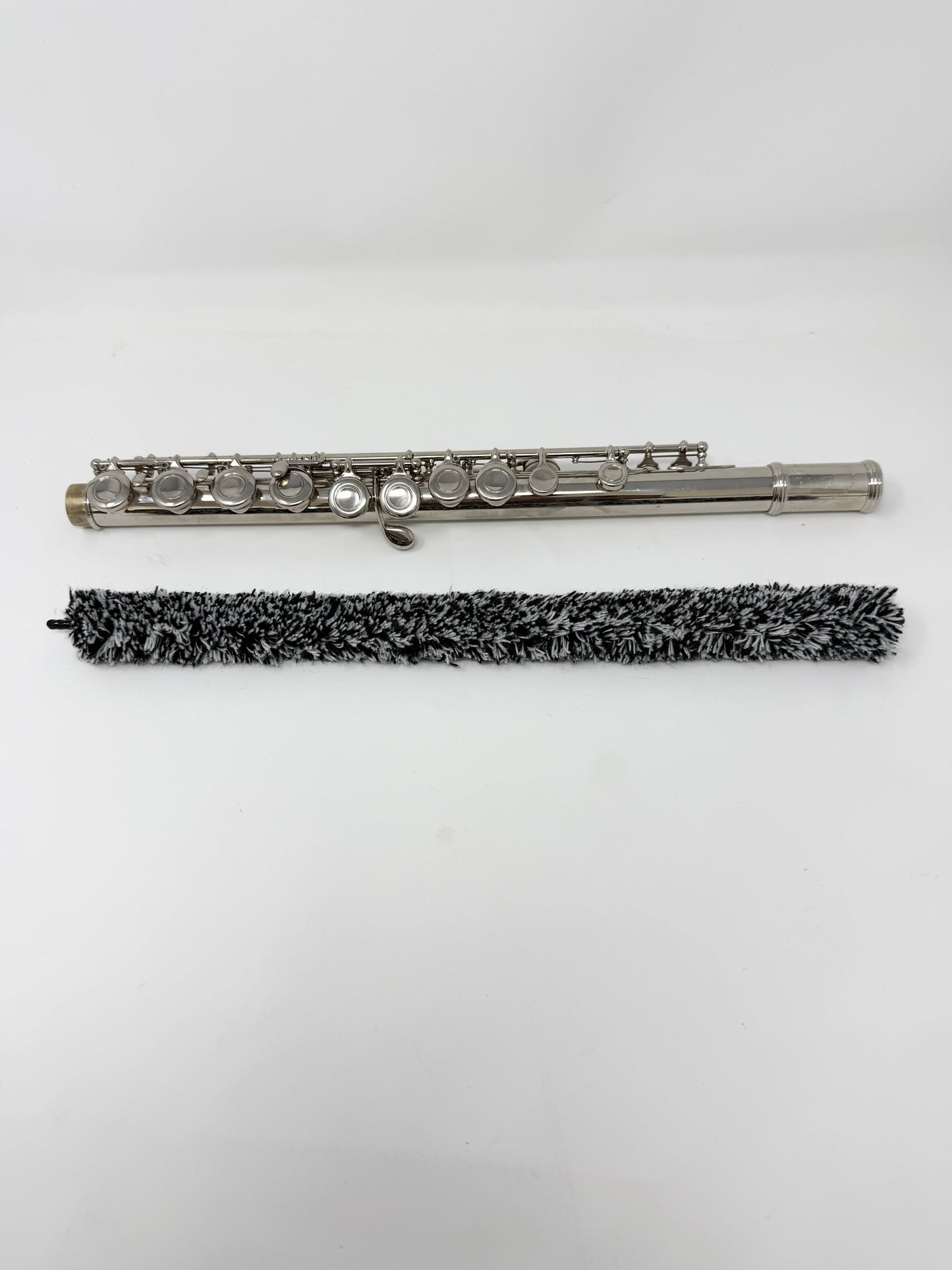 Close-up of a flute pad saver