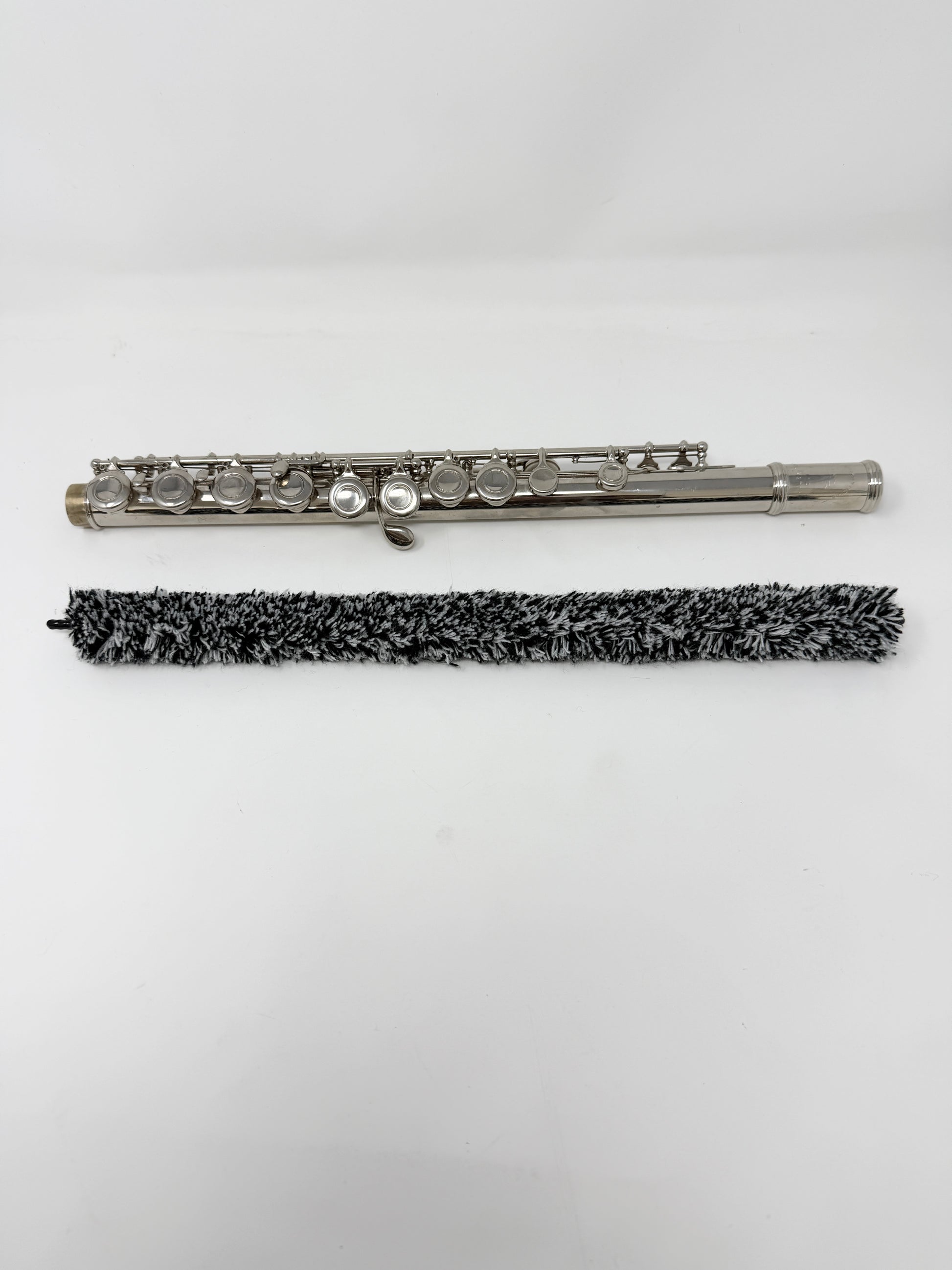 Close-up of a flute pad saver